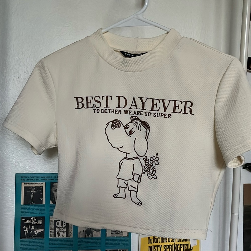 cream colored cropped tee with a cute little dog